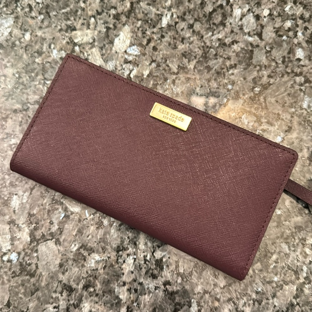 Kate spade maroon wallet with card slots and pockets. NWOT